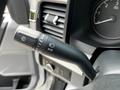 Close-up of a multifunction control stalk from a 2024 Ford F-550 featuring settings for wipers headlights and turn signals