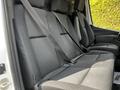 Interior seating of a 2020 Mercedes-Benz Sprinter with multiple seats featuring seat belts in black fabric upholstery