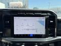 A digital display screen showing navigation settings and controls in a 2024 Ford F-550 Super Duty cab