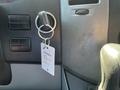 A key in the ignition of a 2010 Mercedes-Benz Sprinter with a keychain tag attached