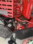 Close-up view of a red 2017 Ferris Rotary mower showing its engine components and framework