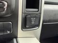 Close-up of the power outlet in a 2018 RAM 1500 with a label indicating 115 V AC and 150 W