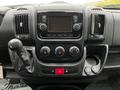 Interior dashboard of a 2018 RAM Promaster featuring control knobs a touchscreen display and gear shift lever