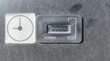 A digital hour meter displaying 1000 hours with a circular clock icon next to it