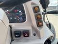Dashboard controls of a 2014 Kubota M7060 including warning and indicator lights for various functions