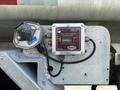A Flotech model F724 retain/dump monitor with a digital display and sensor indicators mounted on a metallic surface