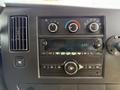 Dashboard of a 2017 Chevrolet Express showing climate control knobs radio display and various buttons