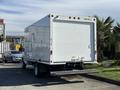 A white 2021 Ford E-450 box truck with a smooth exterior and a loading ramp at the back