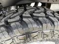 Close-up view of a rugged tire on a 2017 Ford F-250 SD showcasing deep treads designed for off-road performance