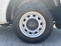 Close-up of a 2011 Chevrolet Colorado wheel showcasing a silver rim and a General Grabber tire
