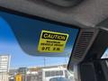 Caution sticker on the windshield of a 2019 Mercedes-Benz Sprinter indicating maximum vehicle height of 9 feet 5 inches