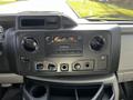 Dashboard of a 2019 Ford Econoline with audio controls and climate control knobs