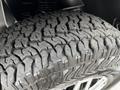 Close-up of a rugged tire with a deep tread pattern designed for traction on a 2020 Mercedes-Benz Sprinter vehicle