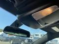 Interior view of a 2019 Dodge Charger featuring the rearview mirror and overhead lights
