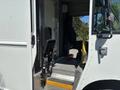 Interior of a 2019 Freightliner MT45 showing a driver's seat and steps leading to the entrance