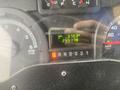 Dashboard of a 2012 Ford Econoline displaying trip mileage of 370.3 and total mileage of 244178 with illuminated gear selector and RPM gauge