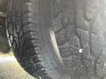 Close-up view of a tread pattern on a 2017 Chevrolet Express tire featuring deep grooves and a rugged design for traction