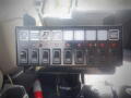 Control panel with multiple switches and indicator lights for a 2016 International WorkStar 7500