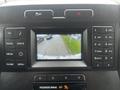 A 2017 Ford F-150 dashboard display showing a rearview camera view with guidance lines indicated