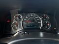 The dashboard of a 2019 Chevrolet Express showing various gauges including speedometer fuel gauge and odometer with a mileage of 353667 km and a temperature reading of 18°C