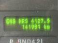 A digital display showing engine hours of 4127.9 and a total of 141931 kilometers on a 2018 Ford E-450