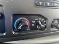 Control panel featuring temperature dials for a 2009 Ford Econoline with settings for cool and warm air and air vent options
