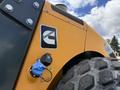 A close-up of a 2020 Hyundai HR110C construction machine showing the Cummins logo and a blue fuel cap valve with a rugged tire in the foreground