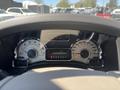 Dashboard of a 2013 Ford Expedition showing speedometer, tachometer, and other gauges along with gear indicator and warning lights