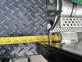 A 2013 Kenworth T370 measuring tape placed on a surface showing a measurement of approximately 129 inches