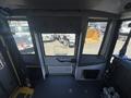 Interior view of a 2020 Chevrolet Express showing the driver's area with a clear view through the windshield and control panel elements visible