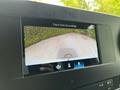 Display screen showing a rearview camera view from a 2023 Mercedes-Benz Sprinter indicating the area behind the vehicle
