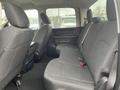 Interior view of the backseat of a 2019 RAM 1500 Classic with black fabric seats and a simple layout