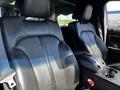 Two black leather seats from a 2013 Lincoln MKT with a central console visible between them