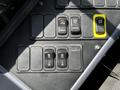 Control panel of a 2022 Blue Bird BB Conventional featuring several buttons and switches for fan control heater and noise suppression