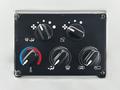 Control panel with five knobs for air conditioning and heating settings featuring temperature gauge and air direction icons