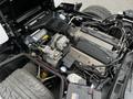 The image shows the engine compartment of a 1992 Chevrolet Corvette featuring a V8 engine with various components and wiring visible