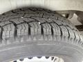 Close-up of a tire with deep treads from a 2009 Dodge Sprinter Van showing wear and texture details