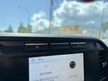 2023 Ford F-550 dashboard display with infotainment screen showing music station and time