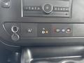 2022 GMC Savana dashboard control panel featuring buttons for power auxiliary features and audio controls