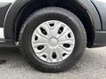 Close-up of a Goodyear tire mounted on a silver and black wheel of a 2023 Ford Transit with an intricate design on the wheel surface