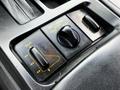 Close-up of the control panel in a 1992 Chevrolet Corvette featuring buttons for seat adjustment and ride control settings
