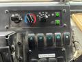Dashboard controls of a 2012 Workhorse W62 featuring various switches knobs and indicator lights for vehicle functions