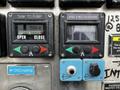 Control panel with gauges and buttons indicating tank operations and discharge functions for a 2009 Spartan Gladiator vehicle