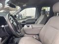 A 2017 Ford F-550 interior featuring a driver's seat and passenger seat with a center console and gear shift visible