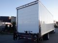 A 2014 International Durastar box truck with a white cargo area visible from the back