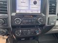 Interior dashboard of a 2019 Ford F-150 featuring a touchscreen display and controls for audio and climate settings