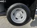 A close-up of a 2011 Ford F-450 SD wheel with a silver rim and a Continental tire labeled HDR