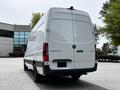 A white 2023 Mercedes-Benz Sprinter van viewed from the rear with the model name and number visible on the back doors