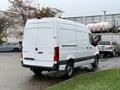 A 2023 Mercedes-Benz Sprinter van in white with a plain rear design and no visible branding