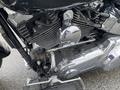 Close-up view of a chrome engine and components of a 2008 Harley-Davidson FLSTFI motorcycle showcasing detailed mechanical parts